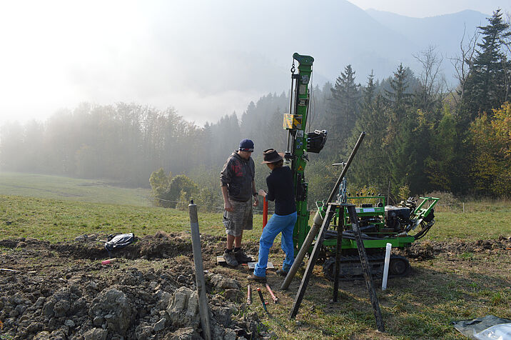 Misty morning in the mountains, researchers setting up their technical equipment
