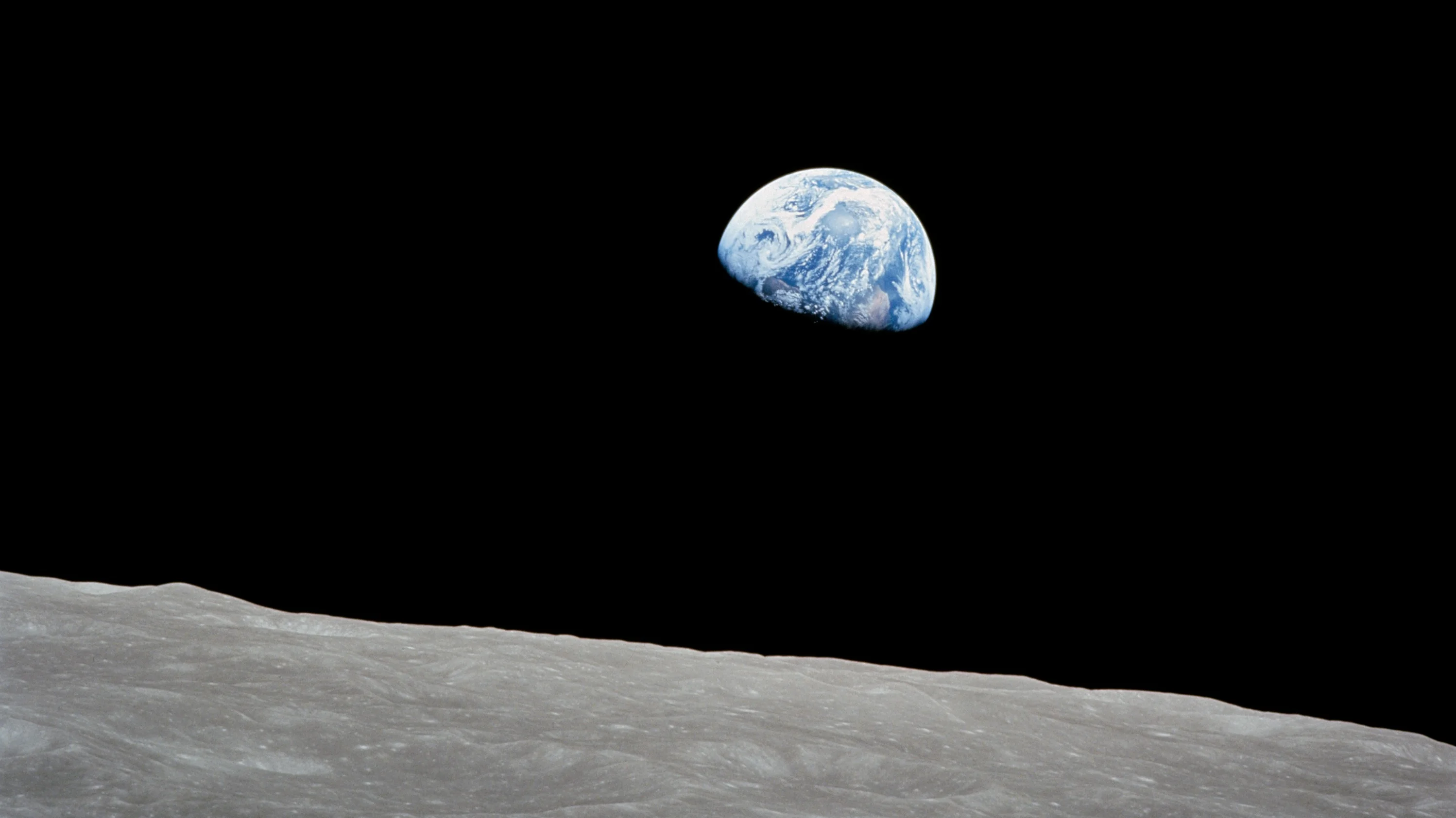 Iconic image of Earth rising over the Moon’s horizon