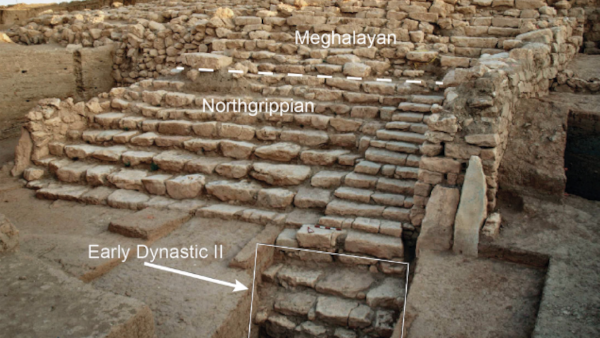 Image of an archaeological site featuring remains of stone walls and stairs